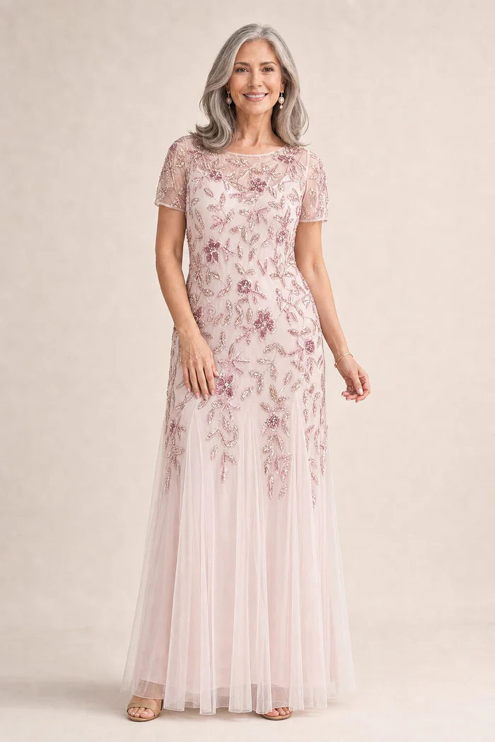 Hand Beaded Blush Pink Short Sleeve Floral Godet Gown by Adrianna Papell mother of the bride dress on model