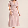 Joyce Flared Blush Midi Refined Glamour in a Flattering Silhouette by Trellis Lane mother of the bride dress on model