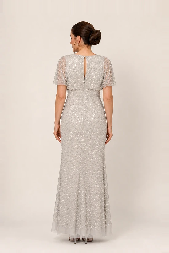 Back view of the crystal silver beaded gown showing the open keyhole back and centre back zip