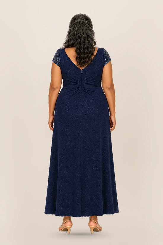 Delphine navy glitter knit gown back view showing the V back and A-line skirt