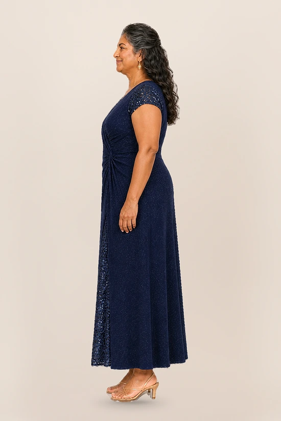 Delphine navy glitter knit gown side view showing the twist waist and sequin godet