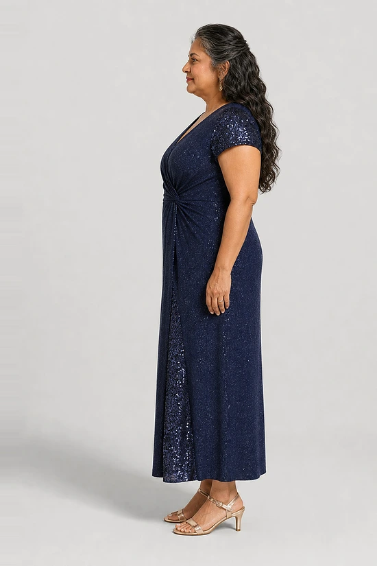 Delphine navy glitter knit gown side view showing the twist waist and sequin godet