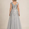 Back view of the silver glitter embroidered gown showing the V-shaped back and full tulle skirt