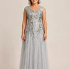 Silver glitter embroidered gown with a soft trumpet tulle skirt, V-neckline and cap sleeves, front view, worn by a mother of the bride