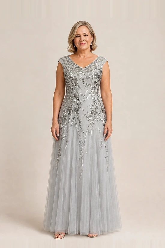 Silver glitter embroidered gown with a soft trumpet tulle skirt, V-neckline and cap sleeves, front view, worn by a mother of the bride