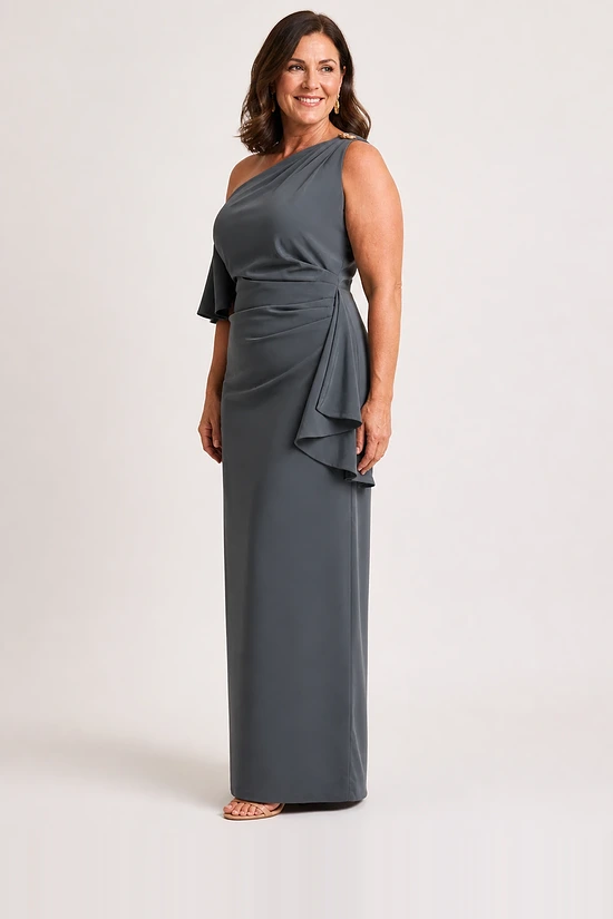 Side view of the charcoal one-shoulder column gown showing the cascading hip ruffle and straight skirt