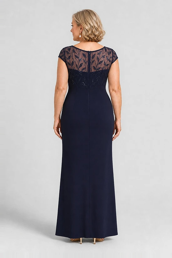 Navy knotted crepe column gown, back view showing the embroidered mesh yoke and centre-back zip, worn by a mother of the bride