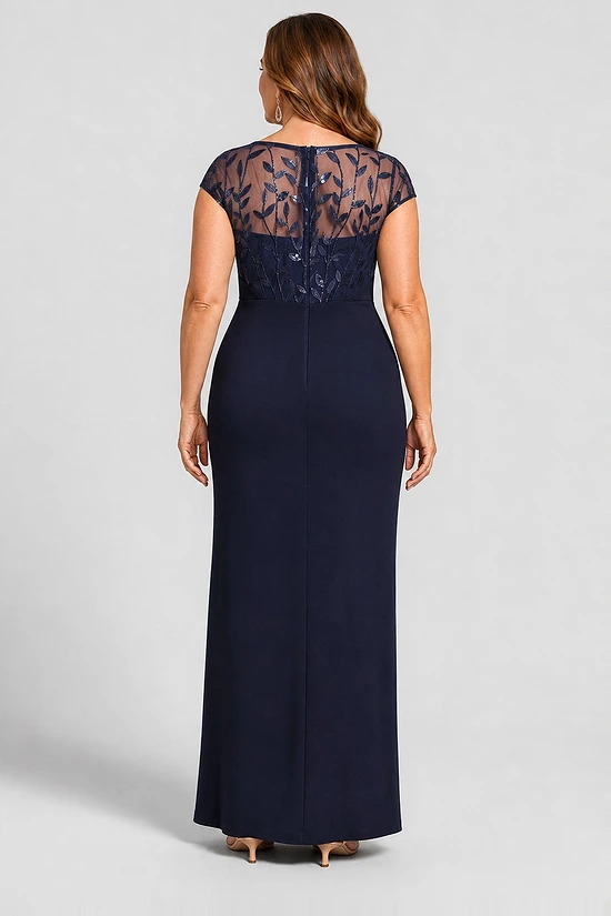Navy knotted crepe column gown, back view showing the embroidered mesh yoke and centre-back zip, worn by a plus-size mother of the bride