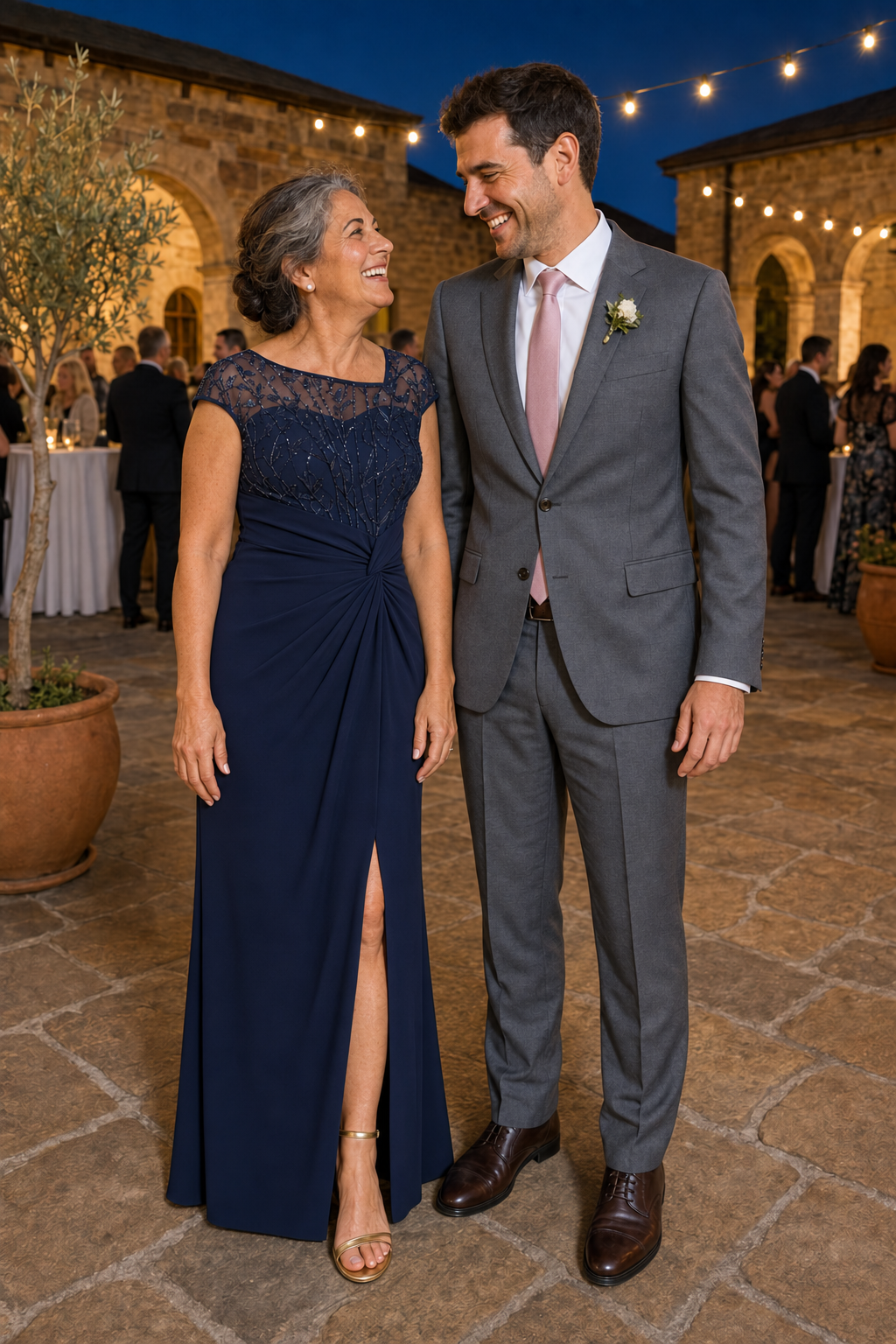 Mother and groom at an outdoor wedding, wearing the Charlotte Navy gown by Dressology