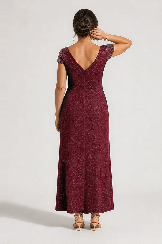 Back view of the Delphine burgundy twist-waist glitter knit gown by Dressology showing the V back and plain A-line skirt