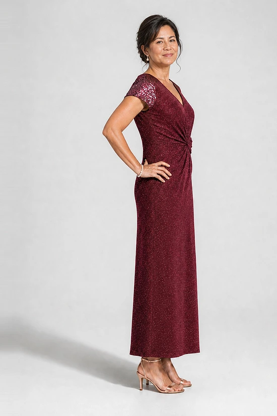 Delphine burgundy glitter knit gown side view showing the twist waist