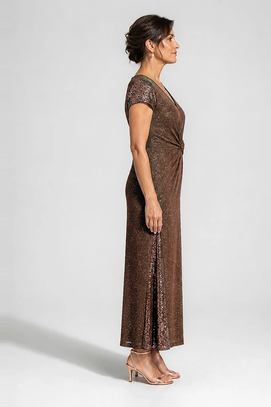 Side view of the Delphine chocolate brown twist-waist glitter knit gown by Dressology on a regular size model