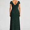 Back view of the Delphine emerald green twist-waist glitter knit gown by Dressology on a regular size model showing the V back and A-line skirt