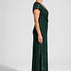 Side view of the Delphine emerald green twist-waist glitter knit gown by Dressology on a regular size model