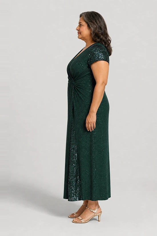 Delphine emerald green glitter knit gown side view showing the twist waist and sequin godet