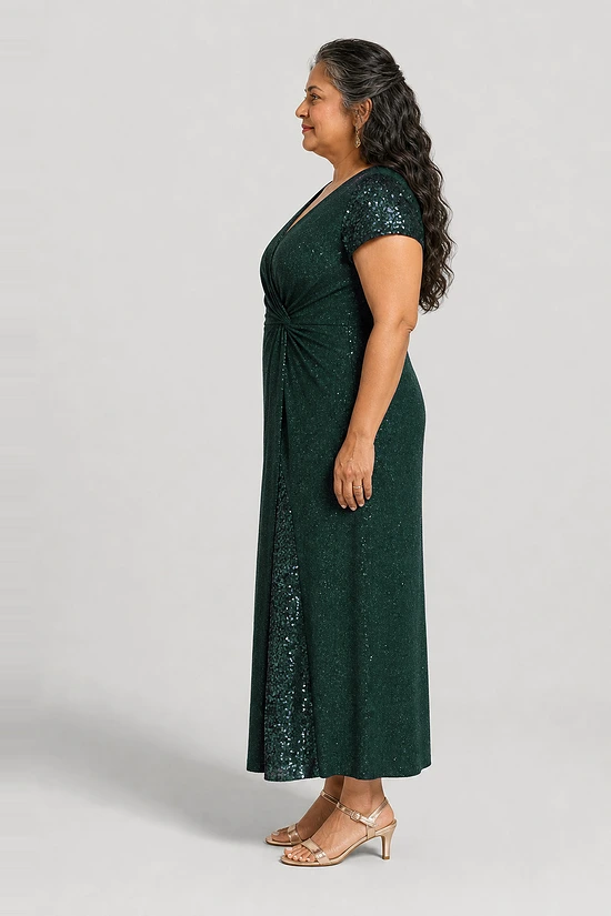 Delphine emerald green glitter knit gown side view showing the twist waist and sequin godet