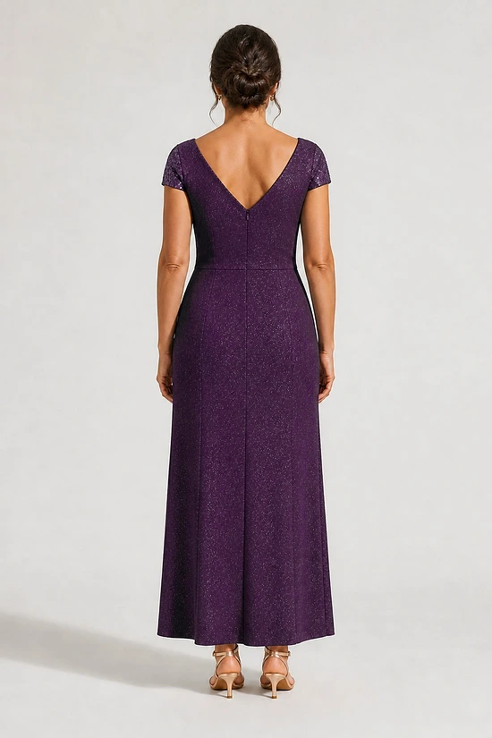 Back view of the Delphine purple twist-waist glitter knit gown by Dressology showing the V back and plain A-line skirt