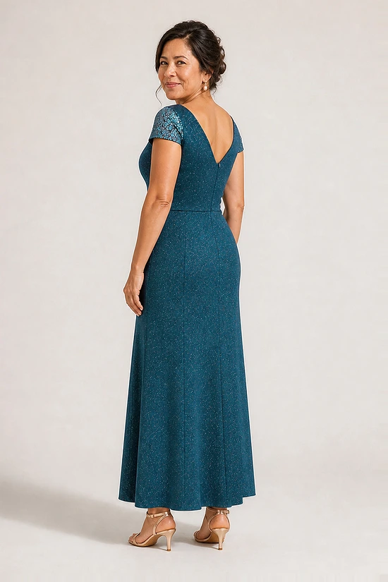 Back view of the Delphine teal twist-waist glitter knit gown by Dressology showing the V back and plain A-line skirt