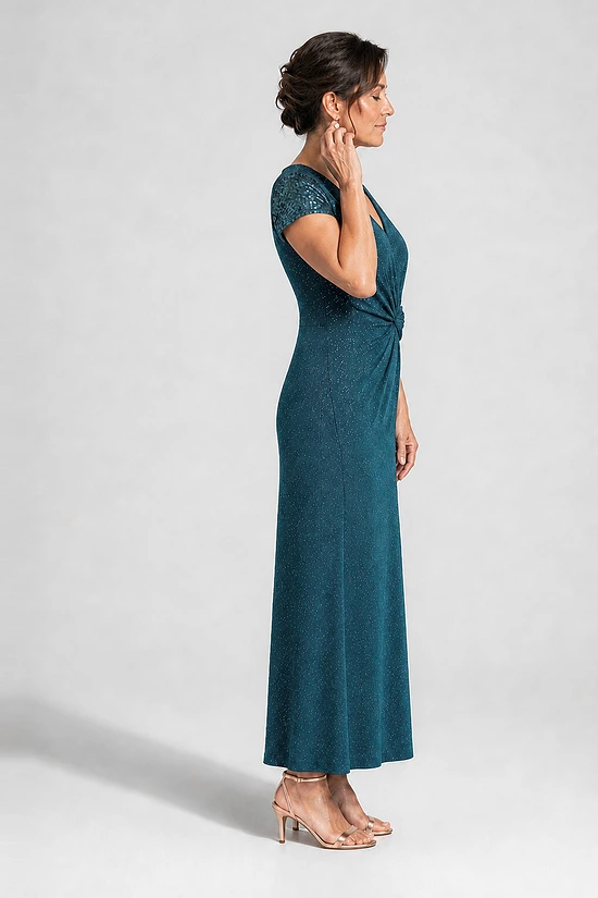 Delphine teal glitter knit gown side view showing the twist waist and plain skirt