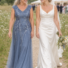 Mother with her adult child at a wedding, wearing the Sylvie Dusty Blue gown by Dressology