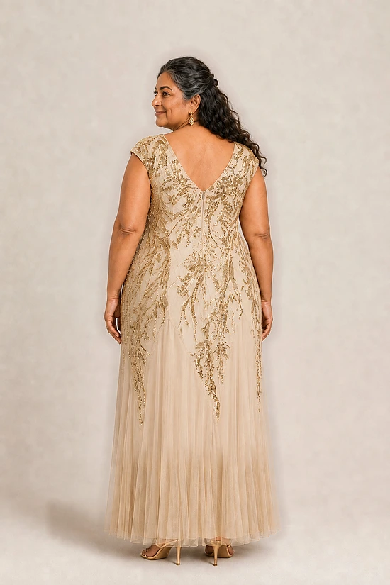 Champagne-gold Sylvie gown by Dressology on a plus-size model, back view