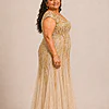 Champagne-gold Sylvie gown by Dressology on a plus-size model, side view