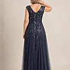 Back view of the navy glitter embroidered gown showing the V-shaped back and the soft trumpet tulle skirt, worn by a mother of the bride