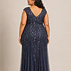 Back view of the navy glitter embroidered gown showing the V-shaped back and the soft trumpet tulle skirt, worn by a plus-size mother of the bride