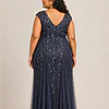 Back view of the navy glitter embroidered gown showing the V-shaped back and the soft trumpet tulle skirt, worn by a plus-size mother of the bride