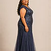 Side view of the navy glitter embroidered gown showing the cap sleeve and the soft trumpet tulle skirt, worn by a plus-size mother of the bride