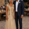 Mother and groom at an outdoor wedding, wearing the Sylvie Gold gown by Dressology
